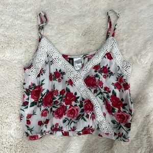 Cute, cropped tank top with red flowers, size 0, true to size, gently worn